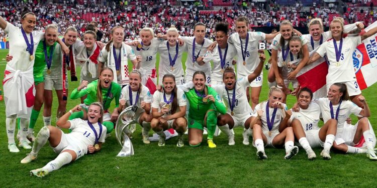 England Women's players celebrate winning the European Championship after beating Germany in the final at Wembley