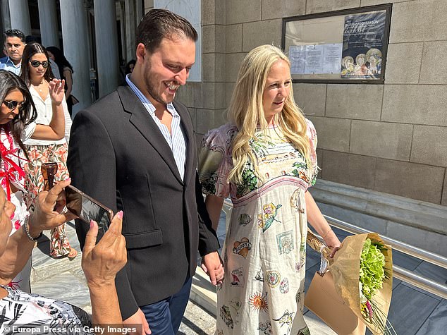 Theodora wore her platinum blonde tresses down in relaxed waves and sported a natural, dewy make-up look as she walked hand-in-hand with Matthew and held onto a bouquet of flowers