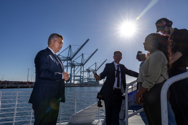 Croatian Prime Minister Andrej Plenković, left, traveled with a delegation...