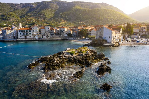 Aerial view of the fishing village Komiza on Vis island in Croatia.