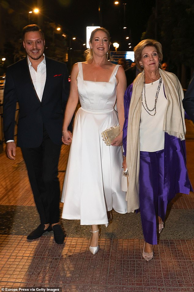 Theodora and Matthew arrive for their pre-wedding reception accompanied by the bride's mother