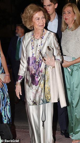 Queen Sofia of Spain opted for a chic floral and silver matching top and trousers combo