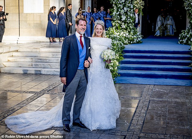 Although Theodora did not have her father to walk her down the aisle as she showcased her stunning wedding dress for the first time, her oldest brother Crown Prince Pavlos performed the role of 'giving away' his younger sister