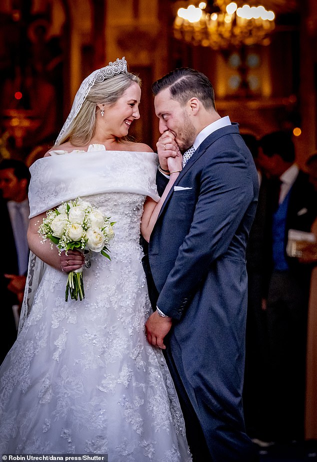 The newlyweds look lovingly into each others eyes as they begin their lives as husband and wife