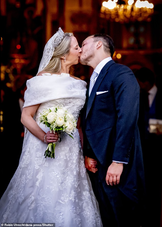 Princess Theodora and Mathew Kumar lovingly share a smooch as they leave the Cathedral