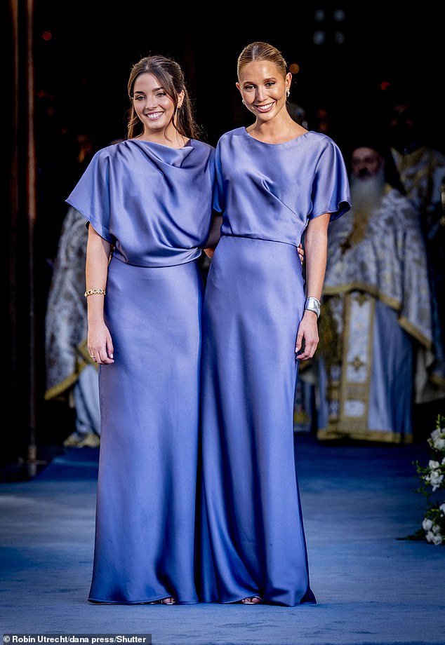 Bridesmaids Arrietta Morales y de Grecia and Princess Olympia pose for a photo before the wedding begins