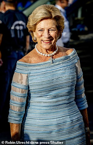 For her daughter's big day, Queen Anne-Marie sported a striking blue striped gown and matching accessories