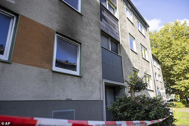 A police cordon outside one of the blocks of flats which were set on fire