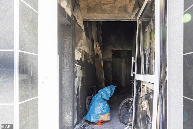 This photo shows a stairwell of a residential building after a fire