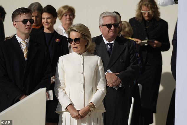 Mathilde donned an all white ensemble, similar to the snow white suit she wore on Friday on the second day of the Pope's weekend visit to Belgium