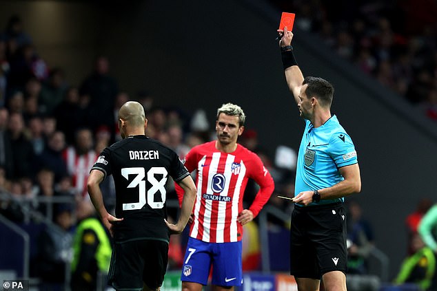 The Japanese striker is sent packing as Antoine Griezmann looks on