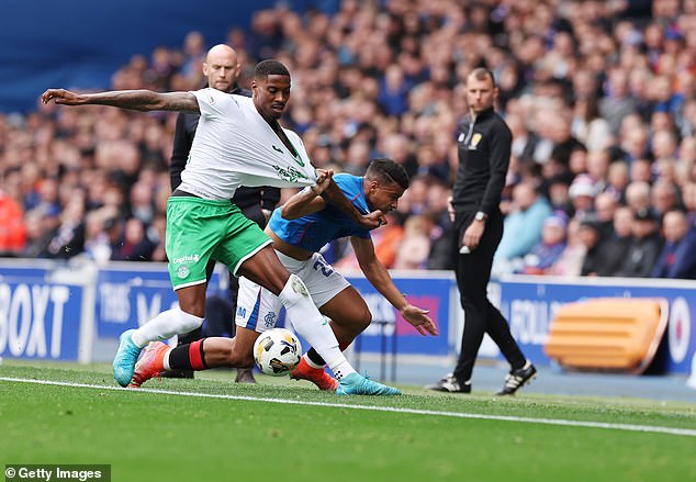 Ekpiteta of Hibs and Igamane of Rangers tussle near to the touchline