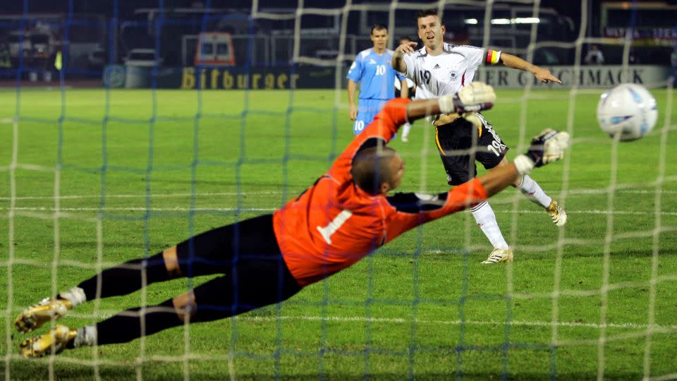 Bernd Schneider makes it 13-0, scoring a penalty past San Marino goalkeeper Aldo Simoncini. - Giampiero Sposito/Reuters