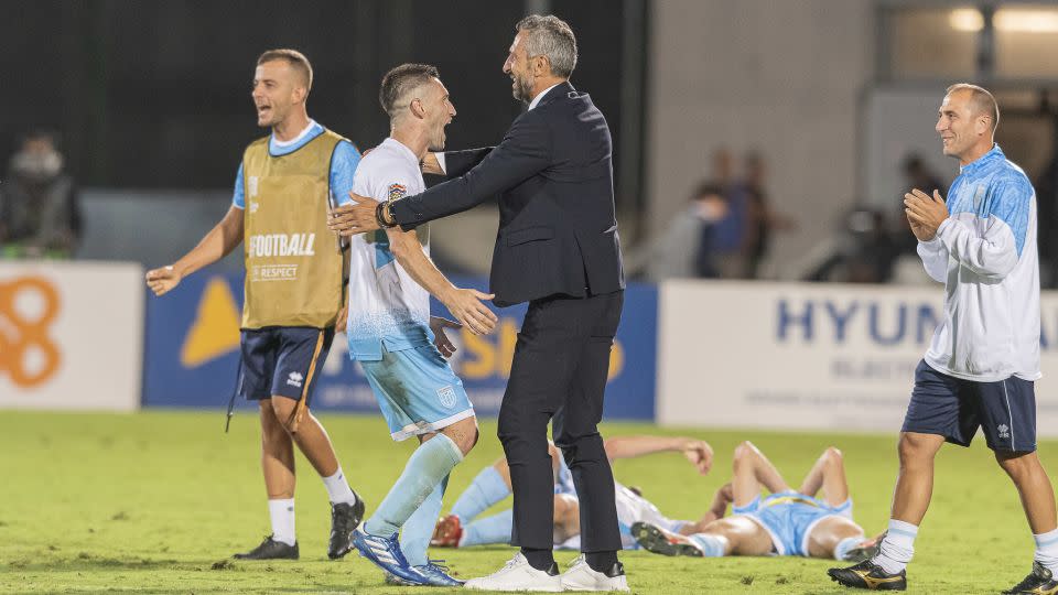 Rossi celebrates with San Marino manager Roberto Cevoli following the 1-0 victory over Liechtenstein. - Pruccoli/FSGC