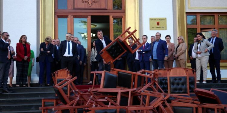 Albanian opposition sets chairs on fire outside parliament in protest