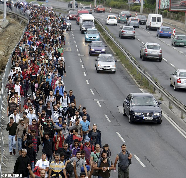 Migrants walk down a street from Keleti train station in Budapest, Hungary in September 2015 (file picture)