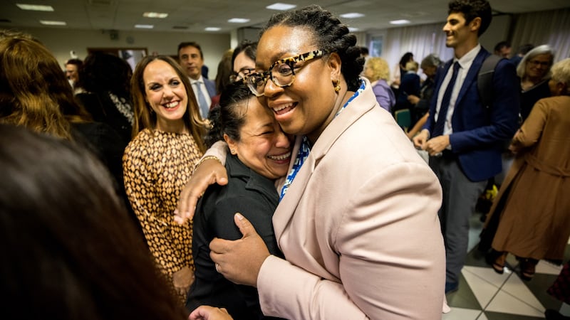 Sister Tracy Y. Browning hugs a woman after a leadership meeting in Milan, Italy.