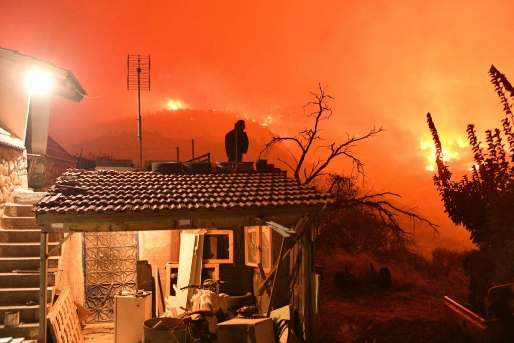 Wildfire burning through forest in southern Greece kills 2 people