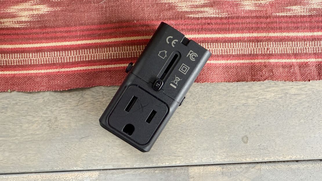 A photo of a Epicka universal power adapter on a table