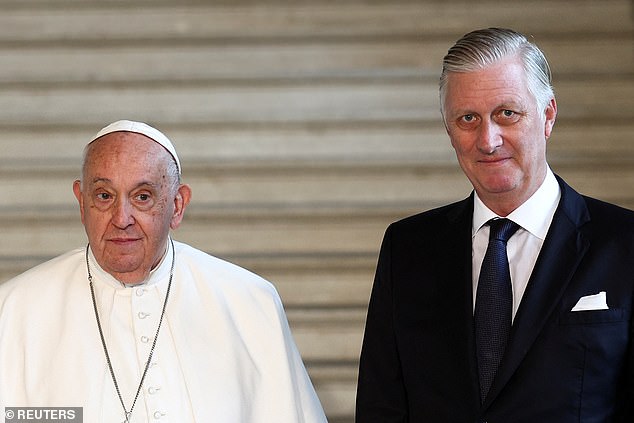 King Philippe looked equally smart in an all black suit, his hair neatly styled for the occasion