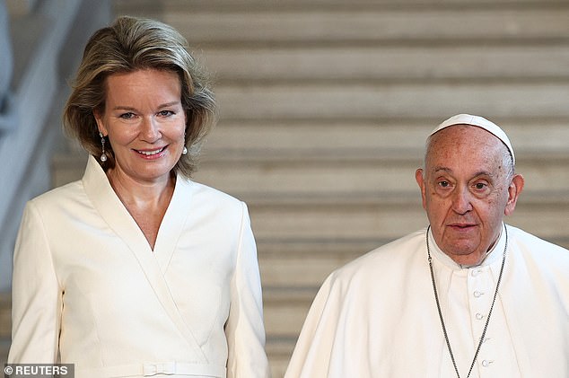 Queen Mathilde posed for a picture with Pope Francis , 87, at the Castle of Laeken, near Brussels during his four-day visit