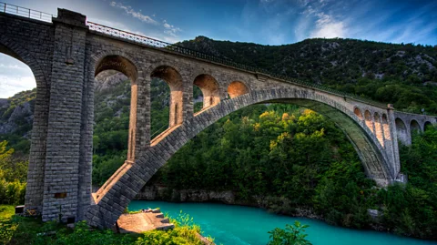 Getty Images The Solkan Bridge arches dramatically over the Soča River, creating a stunning backdrop for hiking, kayaking and picnis (Credit: Getty Images)