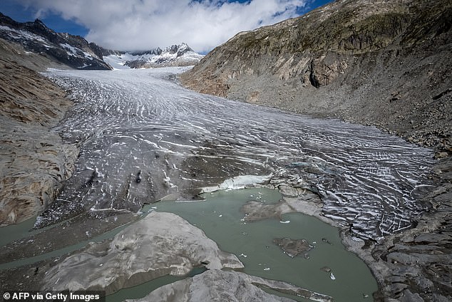 Switzerland's glaciers shed 2.4 per cent of their volume over the past year, with sand blown in from the Sahara accelerating the summer melt. Pictured, Gletsch in the Swiss Alps, September 30, 2024