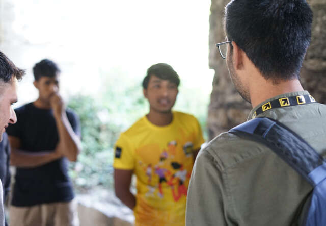 An IRC protection officer speaks with a group of asylum seekers in Trieste, Italy.