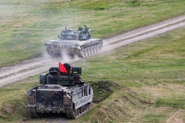 U.S. Army and Czech Republic Army personnel maneuver during a live-fire demonstration hosted by the Czech Republic Army along with visiting Virginia and West Virginia Army National Guard leadership and other special guests May 10, 2024, at Velká...