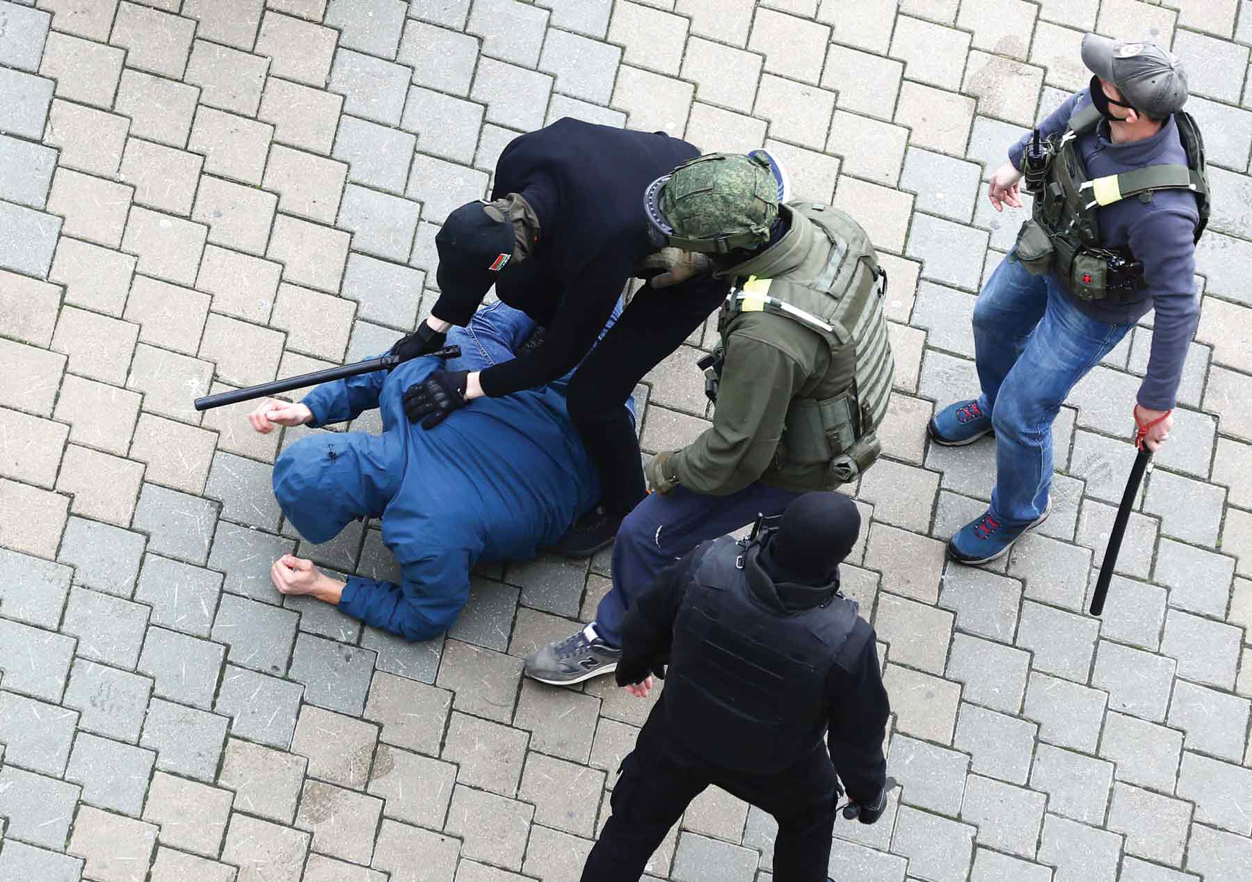 Police detain a man during an opposition rally to protest the official presidential election results in Minsk, Belarus, Sunday, Nov. 8, 2020