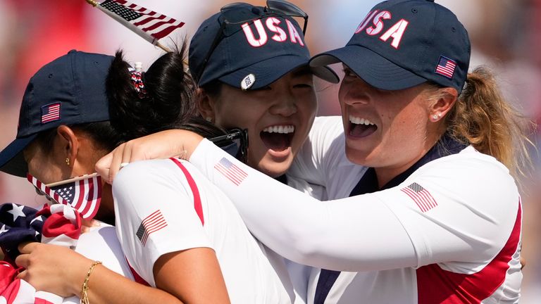 United States players celebrate after winning the Solheim Cup golf tournament at the Robert Trent Jones Golf Club, Sunday, Sept. 15, 2024, in Gainesville, Va. (AP Photo/Matt York)