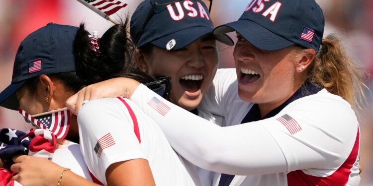 United States players celebrate after winning the Solheim Cup golf tournament at the Robert Trent Jones Golf Club, Sunday, Sept. 15, 2024, in Gainesville, Va. (AP Photo/Matt York)