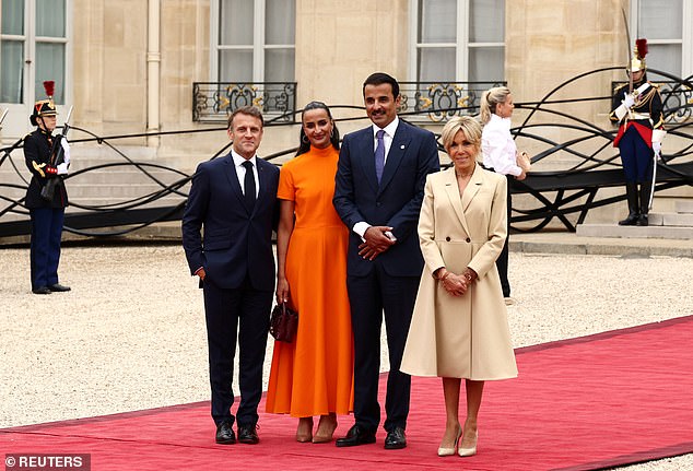 Pictured: Emir of Qatar Sheikh Tamim bin Hamad bin Khalifa Al Thani and his wife at the event today