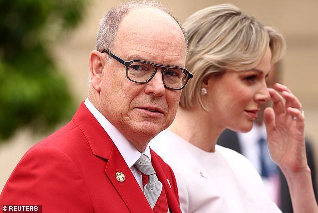 Prince Albert II of Monaco and Princess Charlene arrived to attend a reception for heads of state and government at the Elysee Palace before the opening ceremony