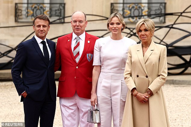 Charlene and Albert grinned as they posed with the Macrons - and chatted with the French president and his wife