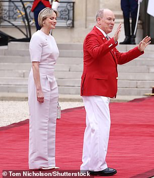 Albert donned a bright red blazer