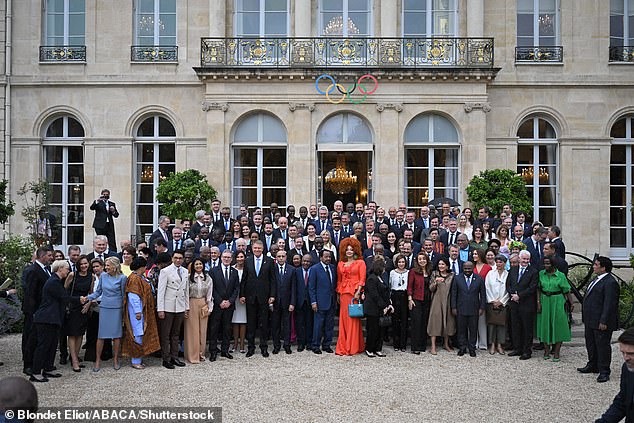 Pictured: French President Emmanuel Macron and his wife Brigitte Macron during a group picture of heads of state and government at reception organized at Elysee Palace