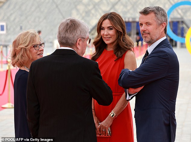 Queen Mary appeared the picture of health today in a stunning red jumpsuit. Pictured with Olympic Committee president Thomas Bach