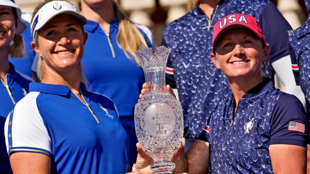 Europe Captain Suzann Pettersen, left, and United States Captain Stacy Lewis pose with the Solheim Cup during team photographs prior to the start of the Solheim Cup golf tournament at the Robert Trent Jones Golf Club, Tuesday, Sept. 10, 2024, in Gainesville, Va. (AP Photo/Matt York)