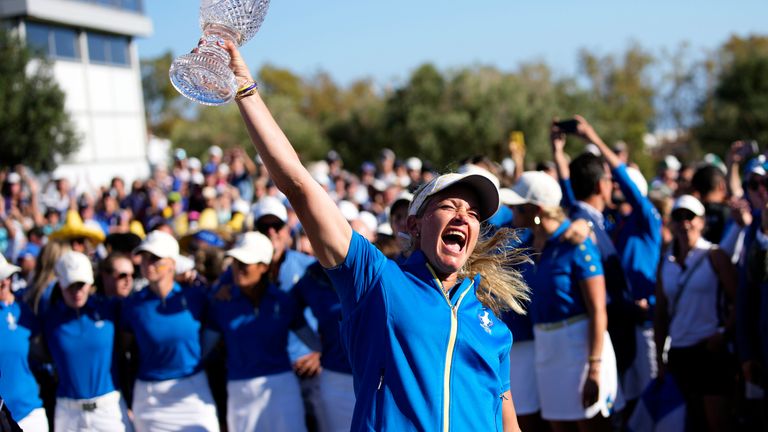 Europe's Team Captain Suzann Pettersen lifts the trophy after wining the Solheim Cup