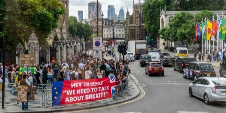 banner saying 'Hey Labour: we need to talk about Brexit!' near Houses of Parliament