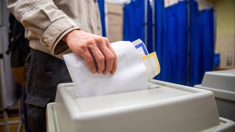 A man votes at a polling station during the European Parliament and local elections in Hungary. Pic: AP