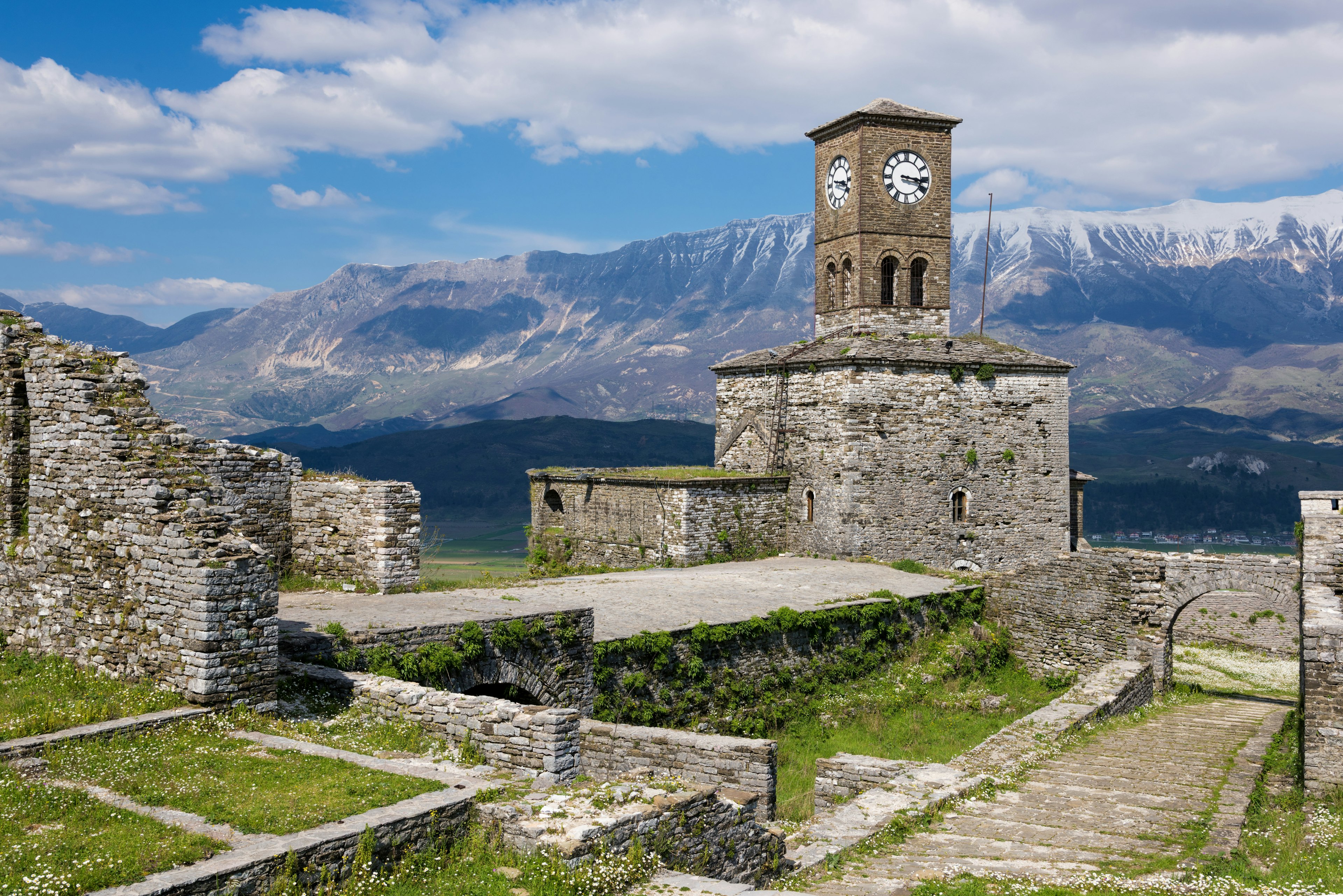 Stone castle with a tall clock tower