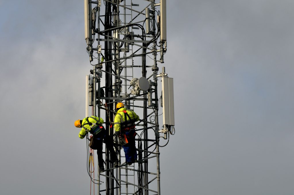 Photo: Telecommunications technicians repair a phone network antenna in Dublin, Ireland.
(Jan 16, 2009). Credit: Douglas O’Connor.