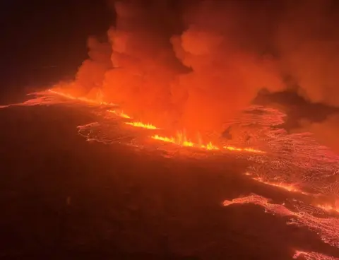 ICELANDIC COAST GUARD An aerial view of a volcano spewing lava and smoke as it erupts