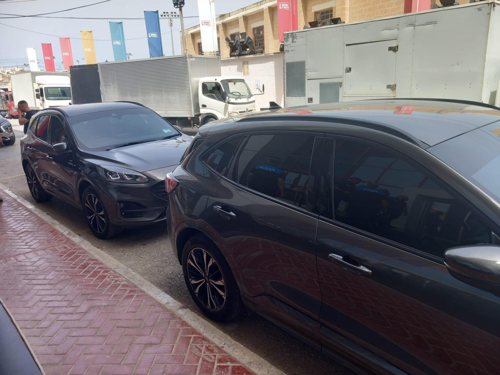 Cars that form part of the PM's security team outside Mile End. Photo: Daniel Ellul