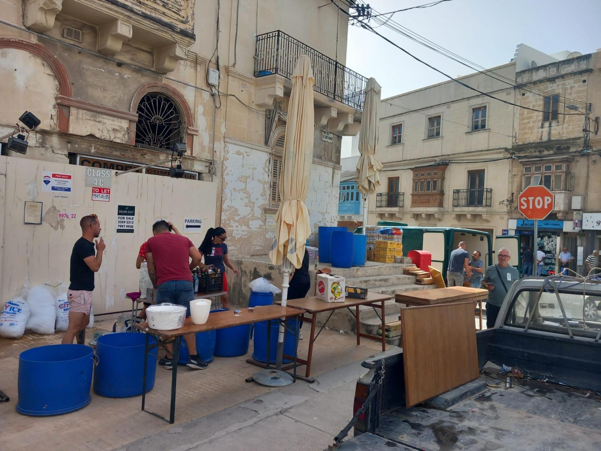 Setting up a streetside bar in Ħamrun. Scroll right to see more photos. Photo: Daniel Ellul