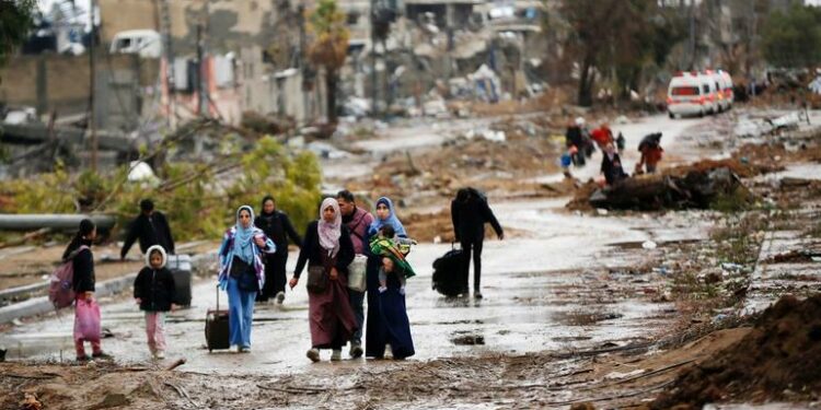 UNRWA. Displaced people walk from the north of Gaza towards the south, as ambulances head in the other direction.