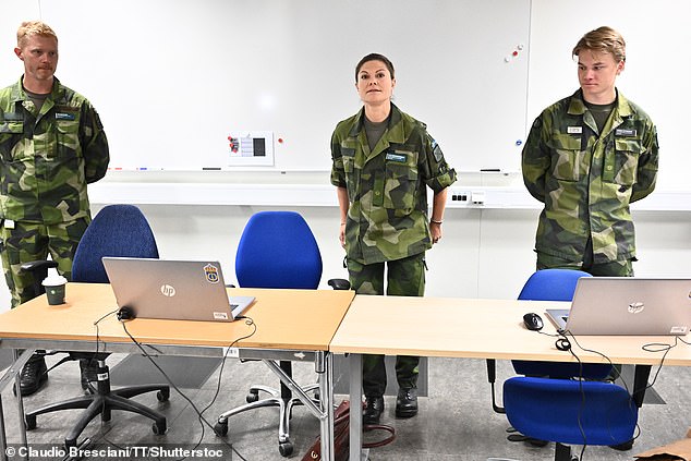 Princess Victoria photographed at the Swedish Defence University, alongside fellow cadets