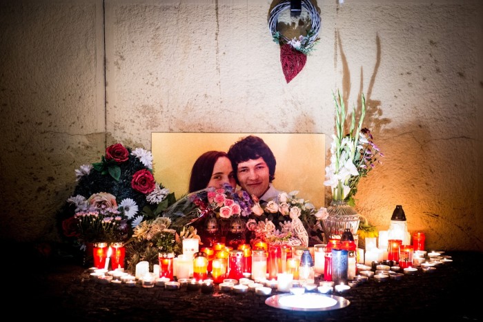 portraits of murdered Jan Kuciak and his fiancee Martina Kusnirova during a vigil to honour their memory in Bratislava